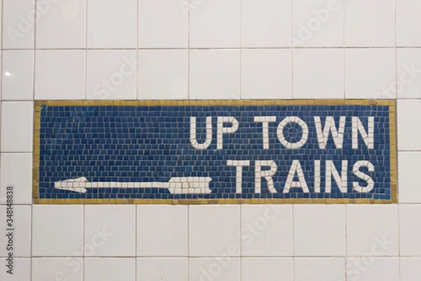 Fototapeta Sign and direction arrow for up town trains in New York City