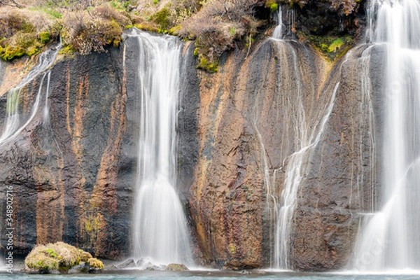 Fototapeta Hraunfossar waterfall cascade in the Reykholt area in Iceland. Travelling, nature and holiday concept.