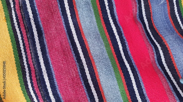 Fototapeta Striped fabric texture background. Texture of traditional Turkish ethnic carpet closeup