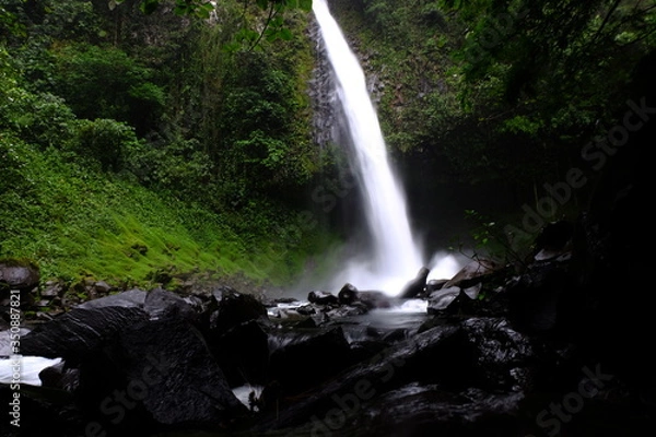 Obraz Long exposure photo at ground level of a river in the center of an Amazon jungle