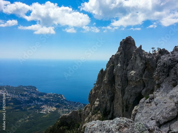 Fototapeta Ai-Petri mountain, Crimean mountains against the blue sky and clouds.