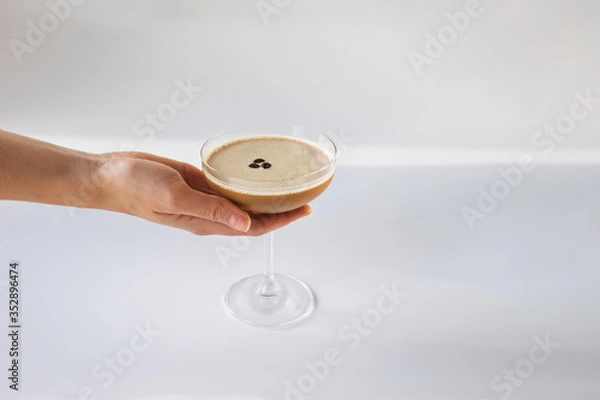 Obraz Hand holding glass with coffee cocktail