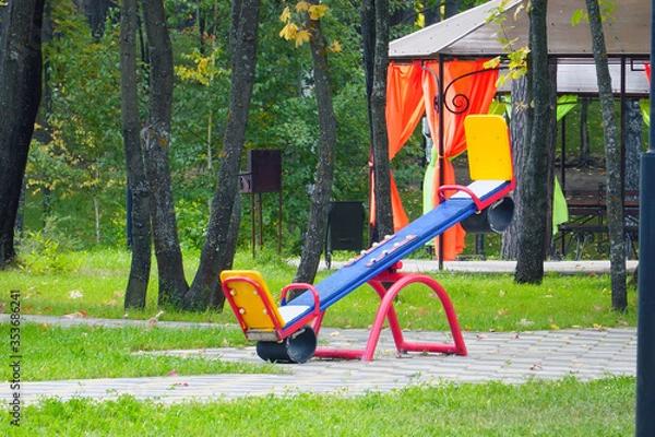 Fototapeta Empty, without children, children's swings in the Park