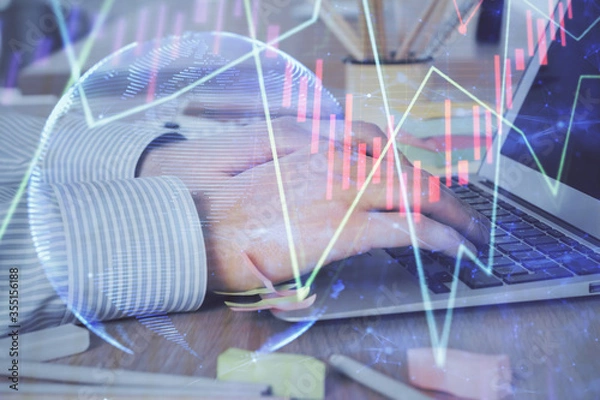 Fototapeta Multi exposure of stock market graph with man working on laptop on background. Concept of financial analysis.