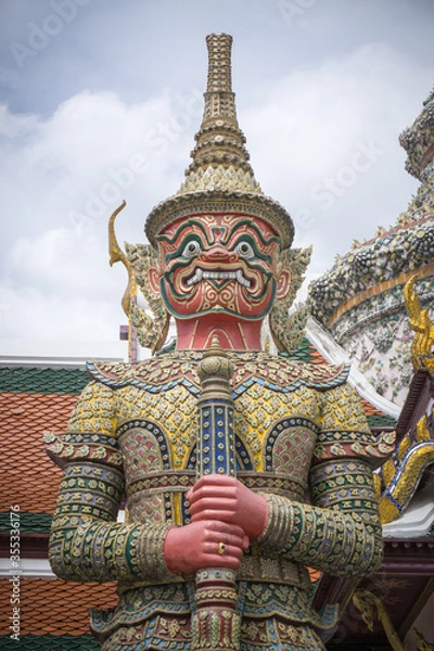 Fototapeta Giant statue at Temple of the Emerald Buddha (Wat phra kaew) ,Bangkok,Thailand.