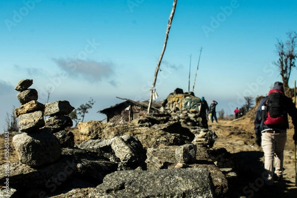 Fototapeta group of hikers on a rock