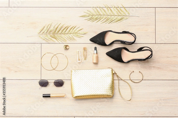 Fototapeta Set of female accessories on light wooden background