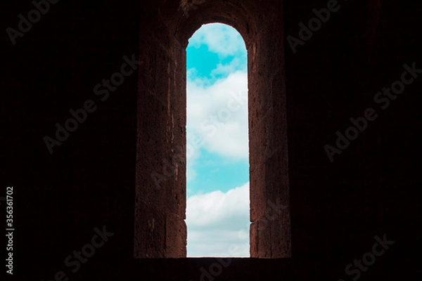 Fototapeta View from the window of the dark monastic