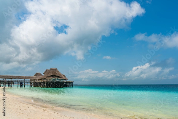 Fototapeta Tropical White Beach with a Traditional Building over Water, Zanzibar Island