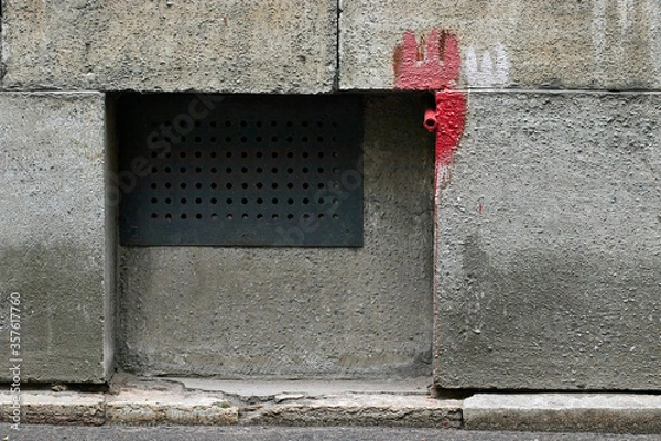 Fototapeta Ventilation on the building wall with cyrillic letter sh