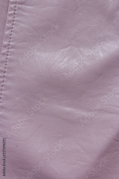 Fototapeta Pink Leather Background. Pink leather texture closeup background. Structured background design leather. A place for text or a logo. Beauty and Fashion. Pink leather jacket.