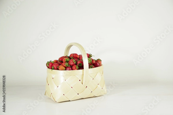 Fototapeta Ripe fresh red strawberries in a basket 