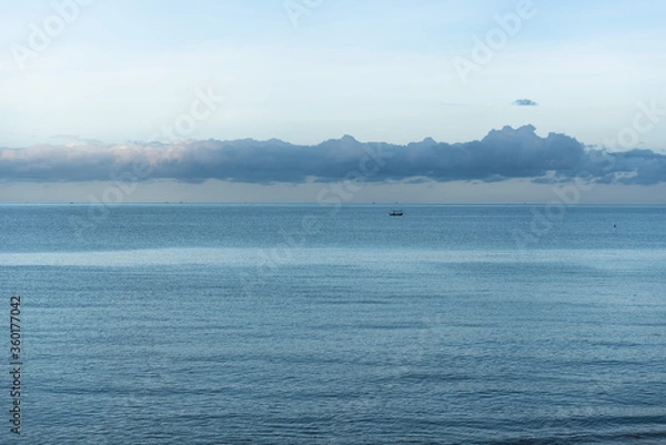 Fototapeta The blue sky and white clouds that cover the vast sea of ​​Thailand during the summer.