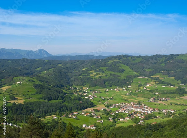 Fototapeta Berastegi municipality with the Aralr mountains and the Txindoki mountain in the background, Euskadi