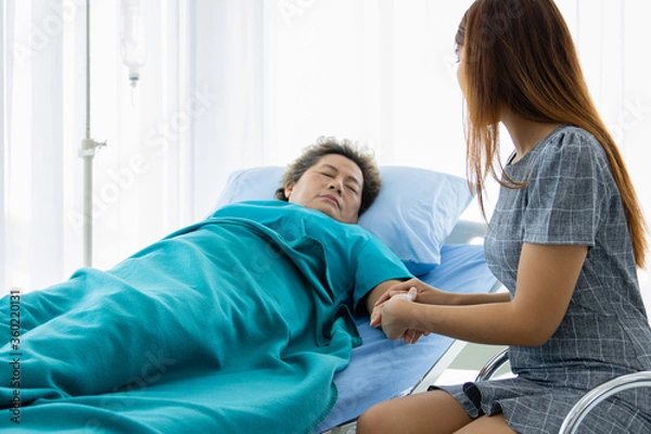 Fototapeta Asian family visit an elderly in a hospital