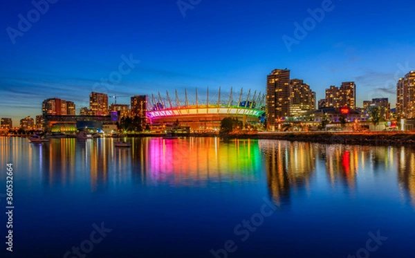 Fototapeta Vancouver skyline on False Creek and BC Place stadium at night in British Columbia Canada