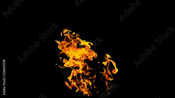 Fototapeta Fire flames on black background isolated. Burning gas or gasoline burns with fire and flames. Flaming burning sparks close-up, fire patterns. Infernal glow of fire in the dark with copy-space