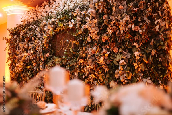 Fototapeta A beautiful romantic wall of real fresh flowers. Decoration for the celebration