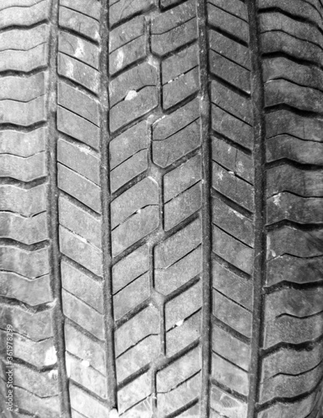 Fototapeta Tread on a car wheel as an abstract background.