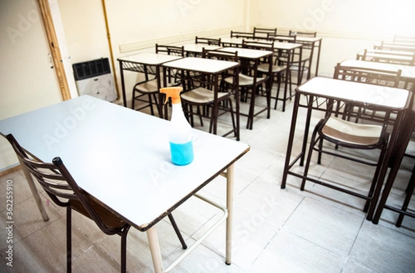 Fototapeta Empty classroom waiting for classes to start after the pandemic