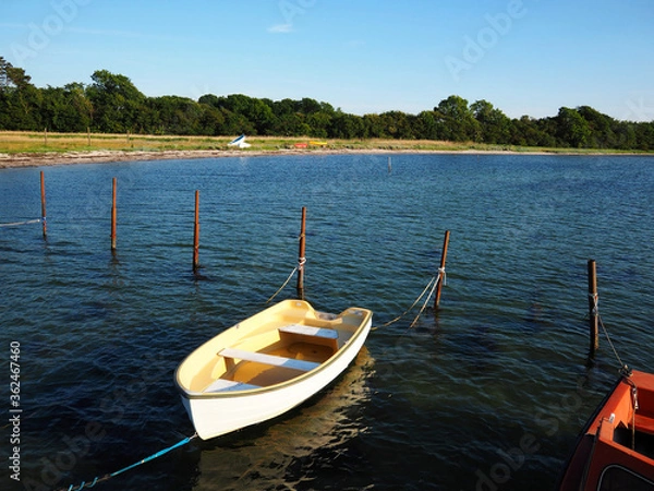 Fototapeta Small fishing dingy boat in a harbour at Funen Denmark