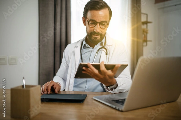 Fototapeta consultation of a doctor on tablet and computer