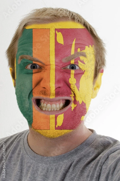 Fototapeta Face of crazy angry man painted in colors of Sri Lanka flag