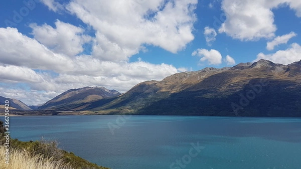 Fototapeta Lake Wakatipu with mountain view and clouds in summer, located in the southwest corner of the Otago region, in the South Island of New Zealand