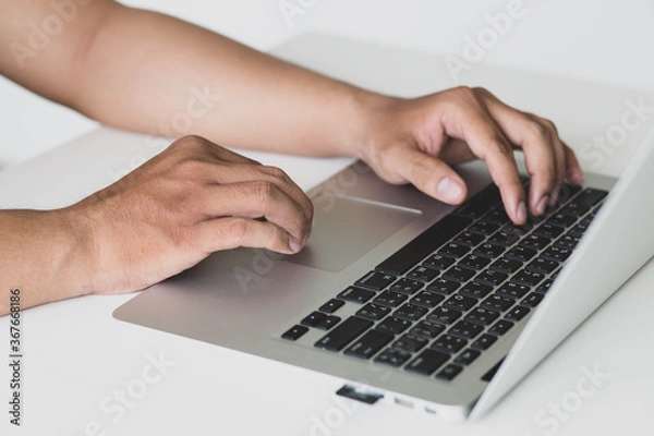 Fototapeta hands  man on laptop on table.