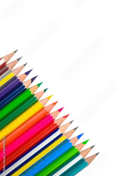 Fototapeta Angle line of different colored wood pencil crayons placed on a white background