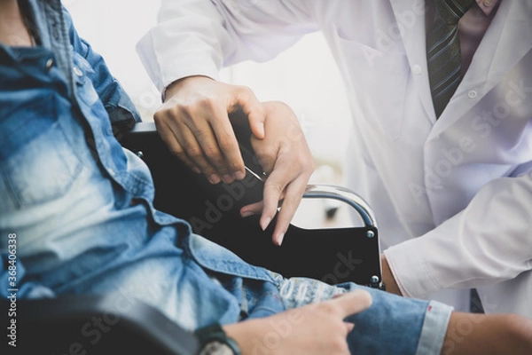 Fototapeta Doctor encourage disabled patient at hospital