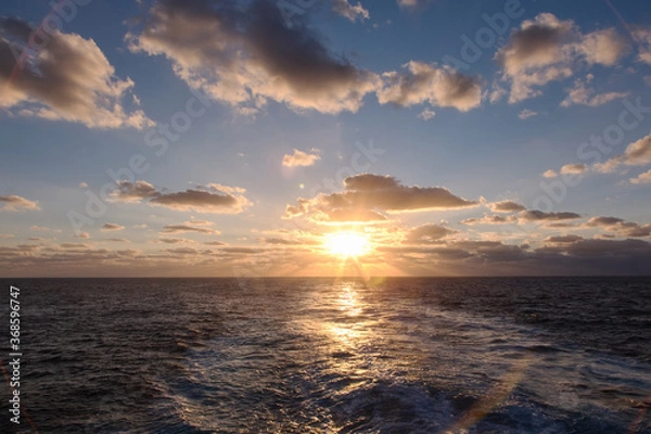 Fototapeta dramatic clouds sea sunset with sunrays