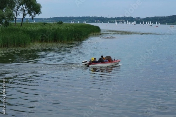 Fototapeta Motorboat sailing on the Vistula river in Poland

