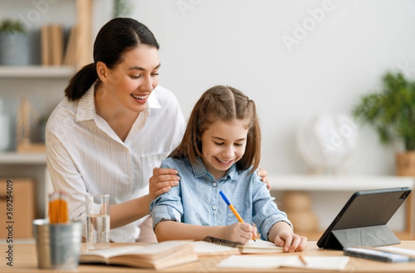 Fototapeta Girl doing homework or online education.