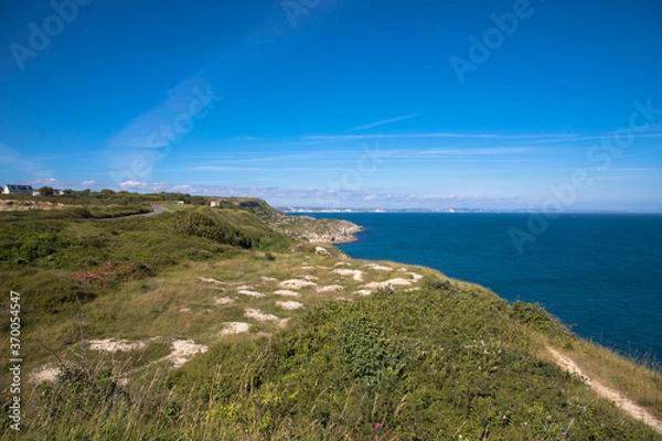 Fototapeta Views of the coast of Isle of Portland with white cliffs of Dorset in the background, Dorset, UK