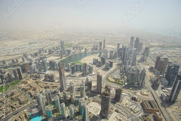 Fototapeta Tall buildings in the future city, Dubai. The picture from a hight