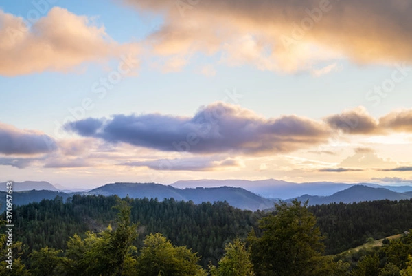 Fototapeta Sunset in mountain landscape.