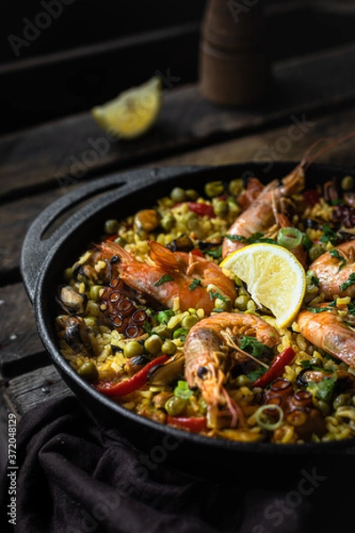 Fototapeta Spain rice dish - seafood paella 