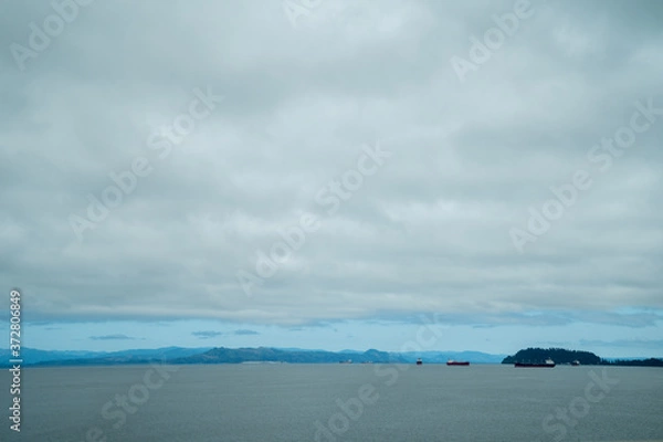 Fototapeta Expansive view of the Columbia River as seen from Astoria, Oregon, with ships and boats in the water