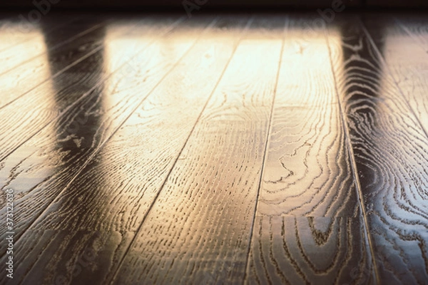 Fototapeta Wooden floor planks with reflecting window light