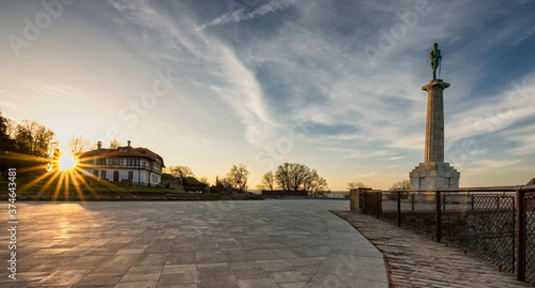 Fototapeta Plateau on Belgrade fortress with Victor monument at sunrise in Belgrade, Serbia