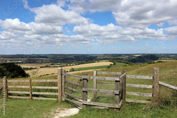 Fototapeta The South Downs National Park view with a wooden gate in the foreground