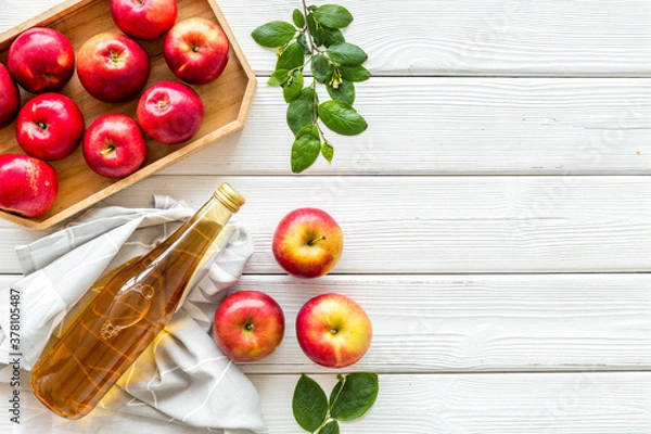 Fototapeta Apple cider vinegar in bottle with fruits top view