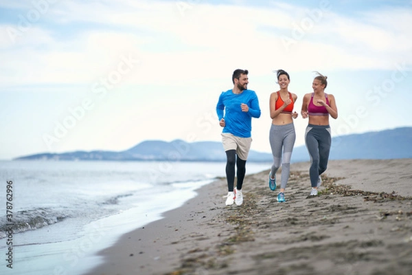 Obraz Friends jogging on the beach