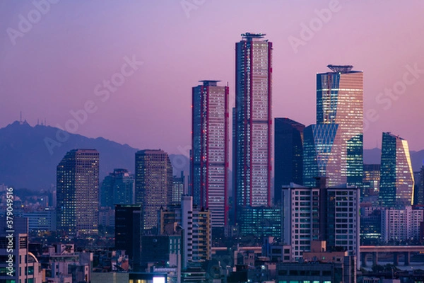 Fototapeta Seoul city skyline at dust at business residential area.