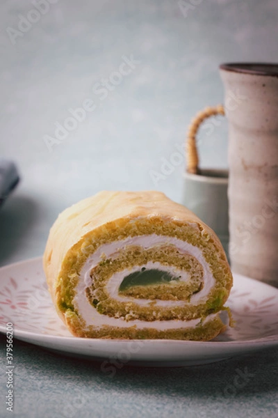 Fototapeta Close up of slice of pandan roll cake