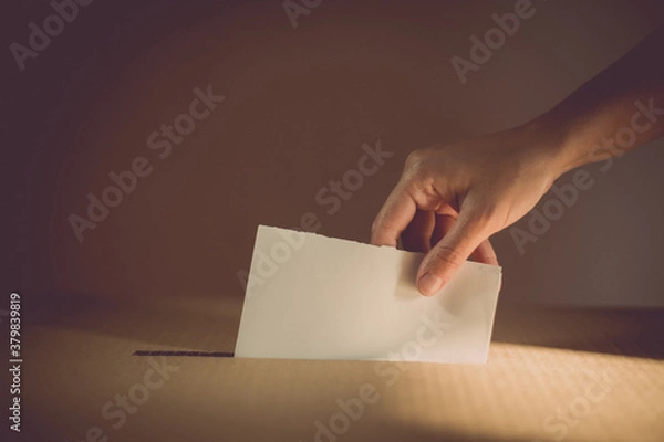 Fototapeta Conceptual image of a person voting during elections