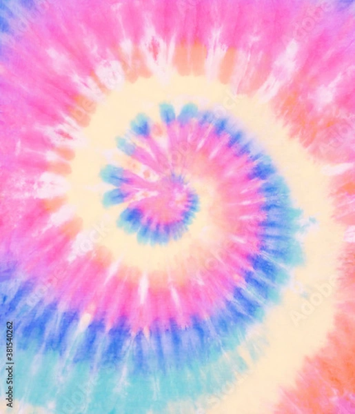 Fototapeta Spiral tie dye wallpaper. Swirl tiedye background in pink blue and green. Boho hippie tie-dye pattern.