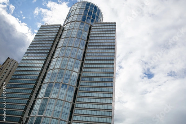 Fototapeta Modern multi-storey building against the sky