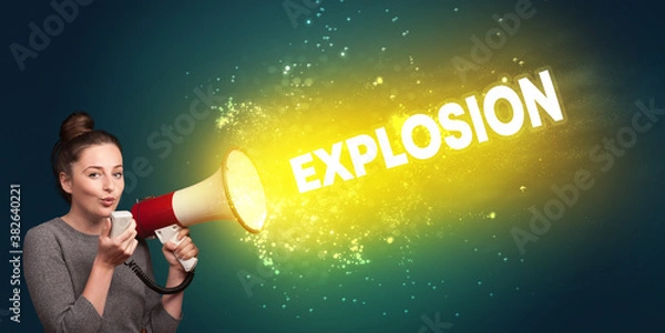 Fototapeta Young woman yelling to loudspeaker with EXPLOSION inscription, modern media concept